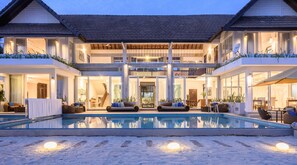 A large, modern house with a swimming pool, multiple balconies, and a covered outdoor seating area. - The Beach House by Reveal (Kamburugamuwa)