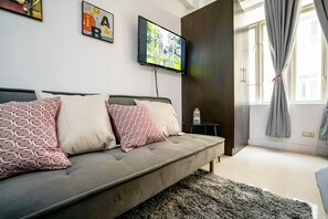 T1 16G | Living area | Flat-screen TV - Indigo McKinley Hill Stamford Residences (Taguig)