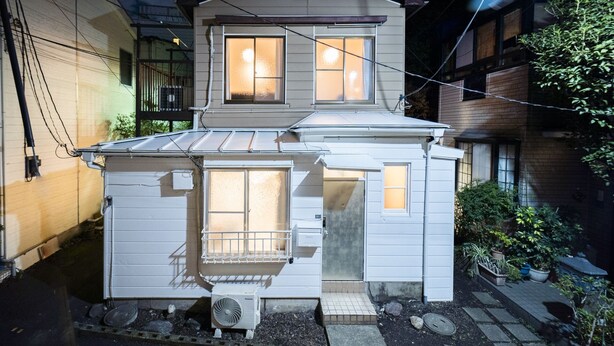A two-story house with a garage, a balcony, and a small garden area. - Satellite Hotel Yoyogi Sangubashi (Tokyo)