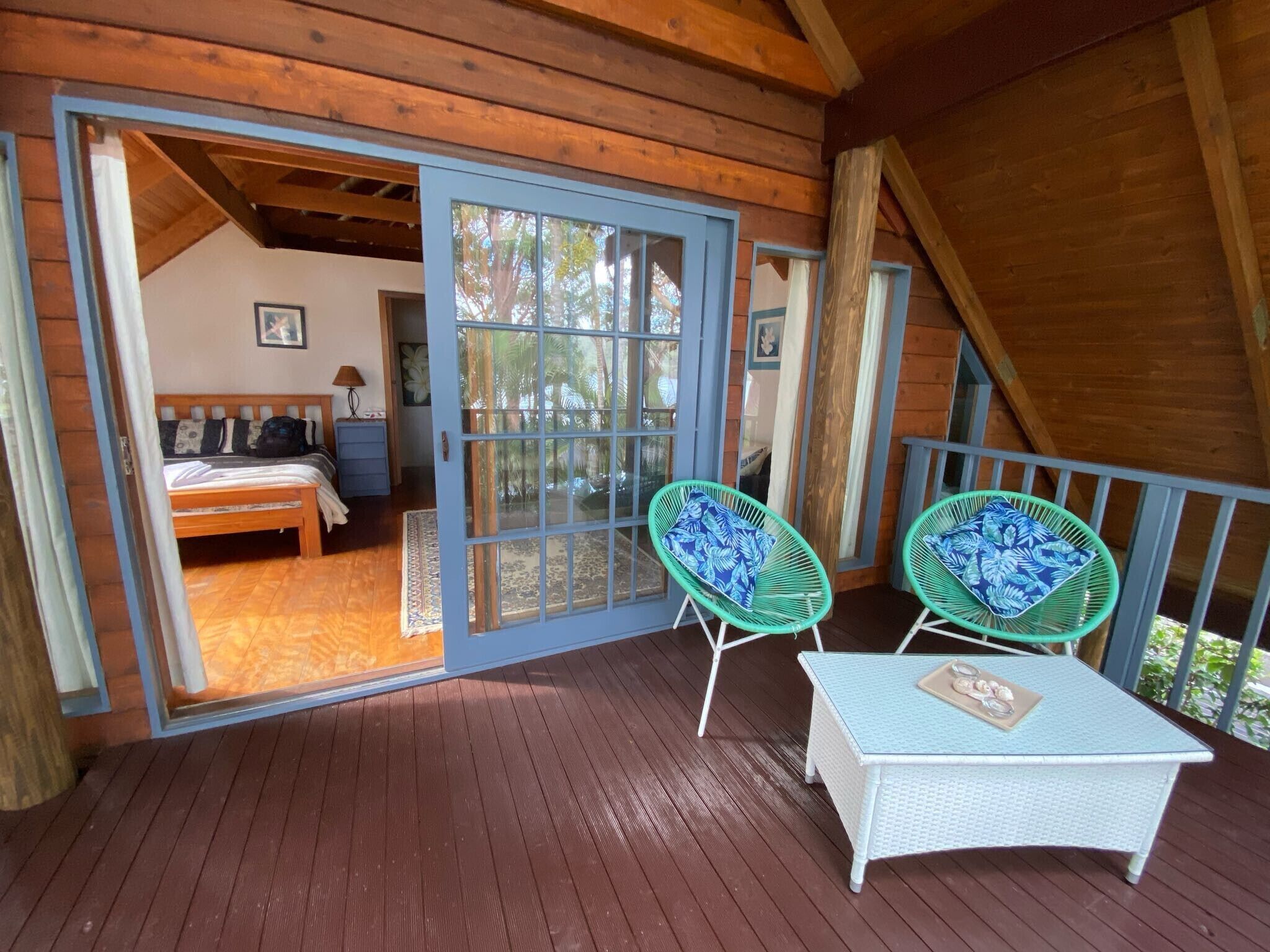 Private covered balcony upstairs with lake views.