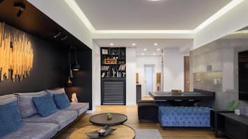 Exclusive Apartment, 4 Bedrooms | Living area | 70-inch flat-screen TV with cable channels, Smart TV, Netflix