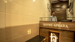 A reception desk at HOTEL APSARA with a check-out time of 10:00 AM for the reception. - Hotel Apsara Near JJ Hospital (Mumbai)