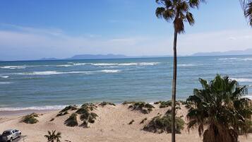 On the beach, white sand, beach towels