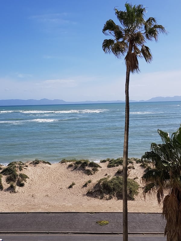 On the beach, white sand, beach towels