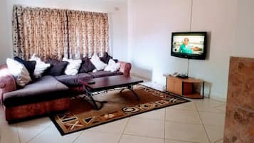 Bungalow familiar (8 pax) | Área de sala de estar