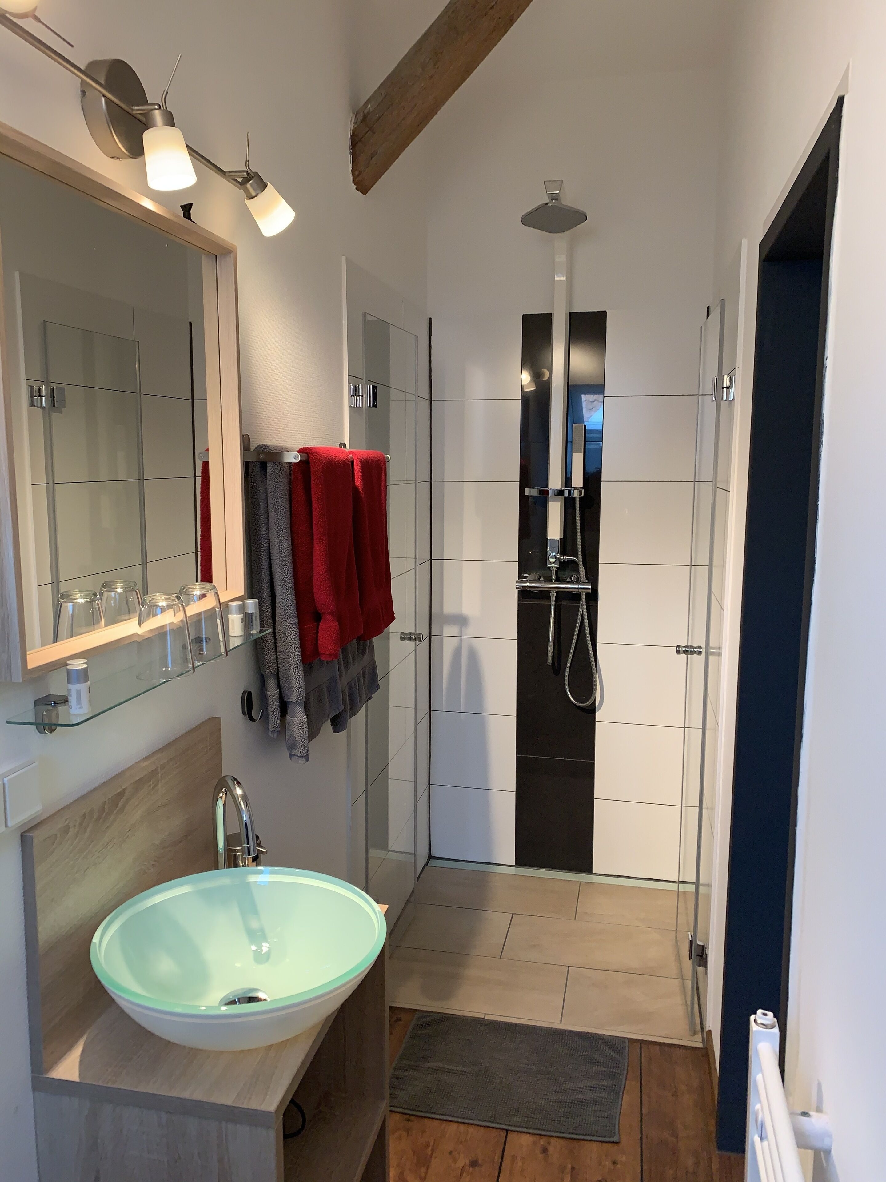 Deep-soaking bathtub, rainfall showerhead, free toiletries, hair dryer