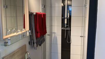 Deep-soaking bathtub, rainfall showerhead, free toiletries, hair dryer