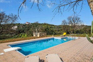 Seasonal outdoor pool, pool umbrellas, pool loungers