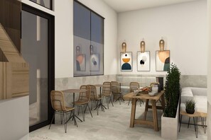 Enjoy casual dining in this inviting space with a variety of seating options and abstract artwork on the walls.