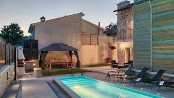 Seasonal outdoor pool, pool umbrellas, pool loungers