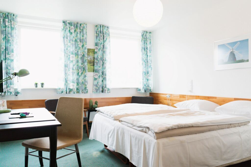 Premium bedding, down comforters, pillowtop beds, desk