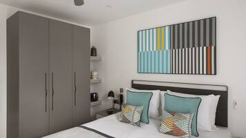 A modern bedroom with a large bed, grey wardrobe, and a ceiling fan.
