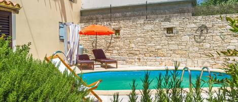 Seasonal outdoor pool, pool umbrellas, pool loungers