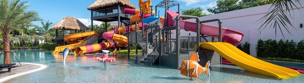 A water park with multiple slides and a pool area. - The Splash Koh Chang (Ko Chang)