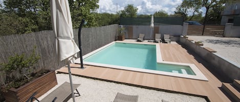 Seasonal outdoor pool, pool umbrellas, sun loungers