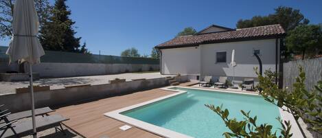 Seasonal outdoor pool, pool umbrellas, sun loungers