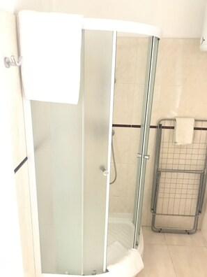City Apartment | Bathroom | Hair dryer, towels, soap, toilet paper