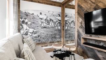 Exclusive Apartment | Living area | 55-inch flat-screen TV with cable channels, TV