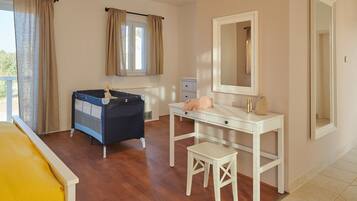 Cozy retreat with a bed, bedside table, and dresser, perfect for a comfortable stay.