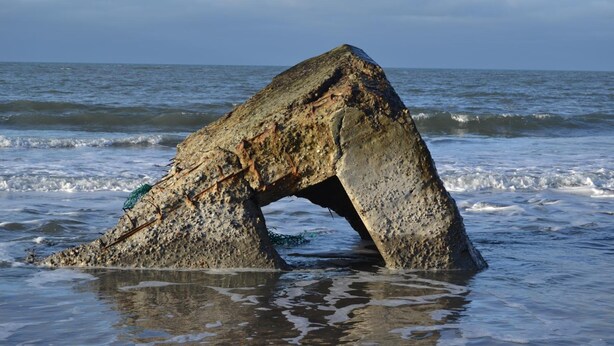 A large rock formation in the ocean with a natural arch. - Danhostel Thyborøn (Thyborøn)