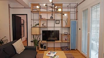 Deluxe Apartment | Living area | 43-inch flat-screen TV with satellite channels, TV, Netflix