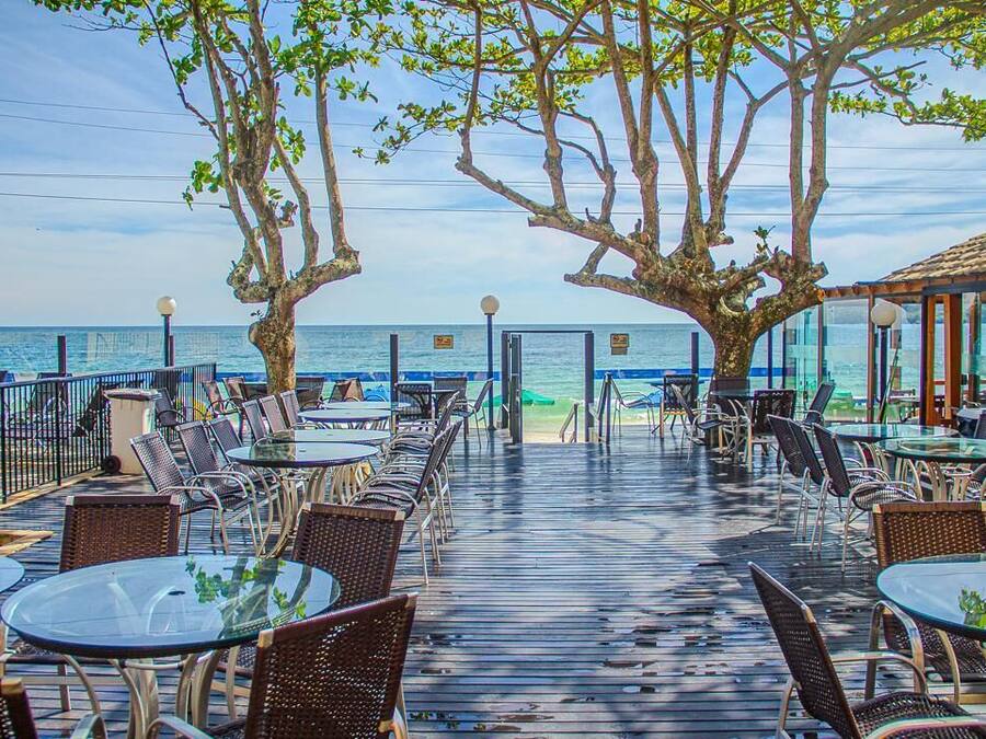 On the beach, white sand, sun loungers, beach towels