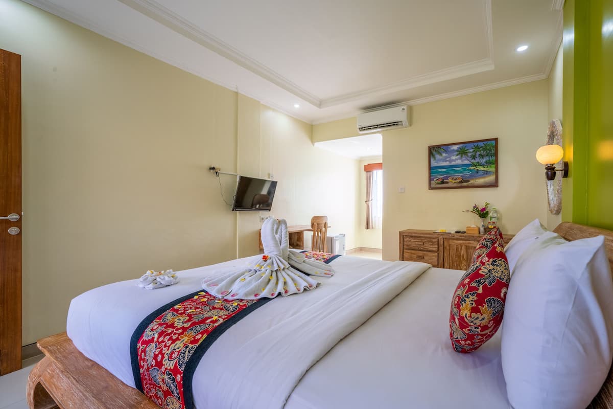 Habitación Deluxe con 1 cama matrimonial o 2 individuales | Minibar, decoración personalizada, muebles diferentes y wifi gratis