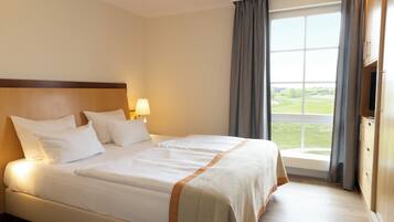 Apartment, 1 Schlafzimmer (Birdie) | 1 Schlafzimmer, hochwertige Bettwaren, Zimmersafe, Schreibtisch