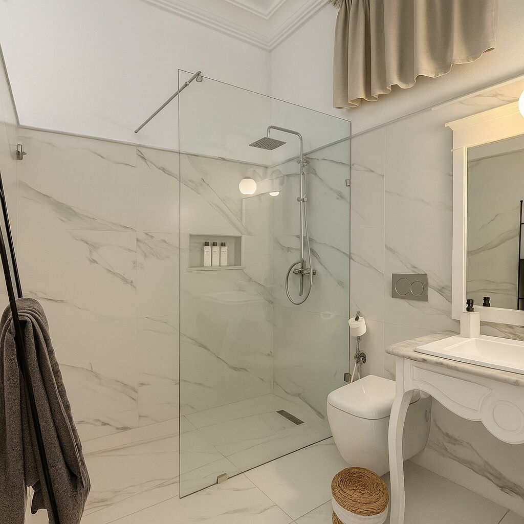 A modern bathroom with a glass-enclosed shower, a white toilet, and a vanity with a mirror.