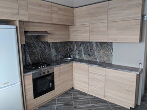 Fridge, microwave, oven, dining tables