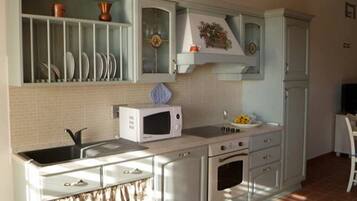 Appartement, 2 chambres (Grano) | Cuisine privée | Grand réfrigérateur, micro-ondes, four, plaque de cuisson