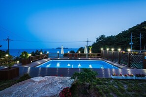 Seasonal outdoor pool, open 9:00 AM to 9:00 PM, pool umbrellas