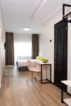 Blackout drapes, soundproofing, free WiFi, bed sheets