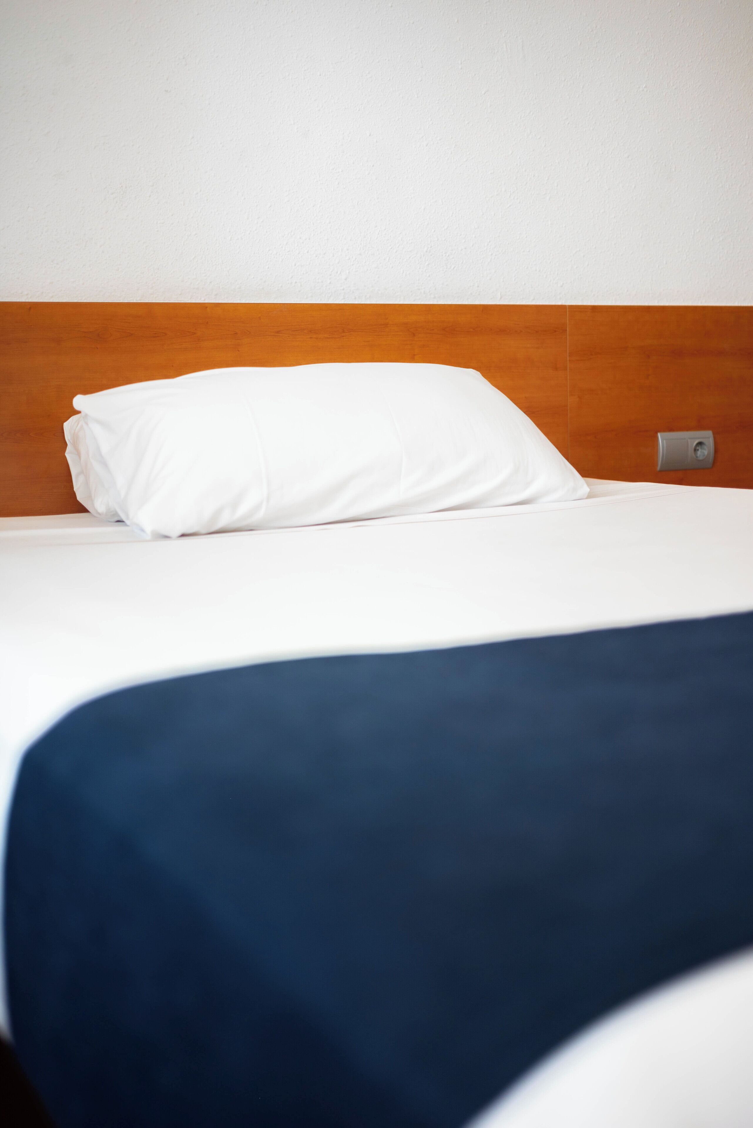 Premium bedding, laptop workspace, blackout drapes, soundproofing