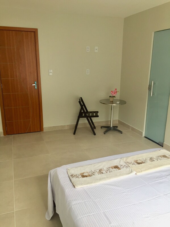 Economy Double Room | Desk, laptop workspace, blackout drapes, iron/ironing board