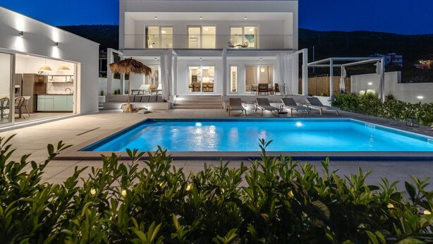 A modern two-story house with a swimming pool, outdoor seating, and a well-lit interior. - Villa Zen with private 32 sqm pool, summer kitchen, 7 km from the beach (Tugare)