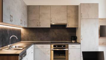 Fridge, stovetop, dishwasher, coffee/tea maker