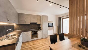 Fridge, stovetop, dishwasher, coffee/tea maker