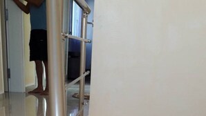A staircase with metal handrails and a beige wall. - Luxurious villa with swimming pool in Midoun (djerba midoun)