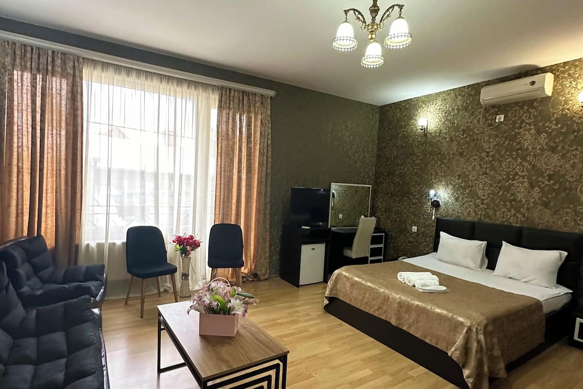 Suite, Balcony | 1 bedroom, premium bedding, minibar, individually decorated