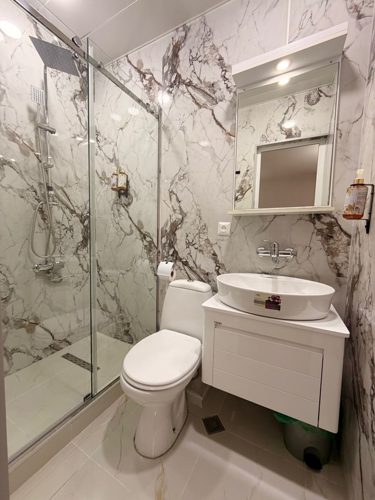 Designer toiletries, hair dryer, bathrobes, slippers