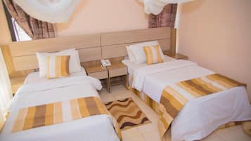 Deluxe Double or Twin Room | Desk, laptop workspace, iron/ironing board, free WiFi