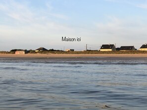 On the beach, sun-loungers