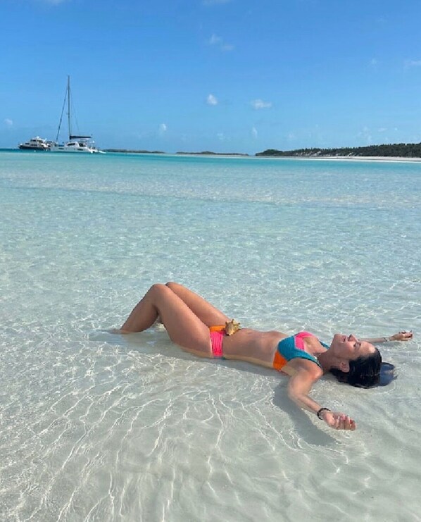 On the beach, sun-loungers, beach towels