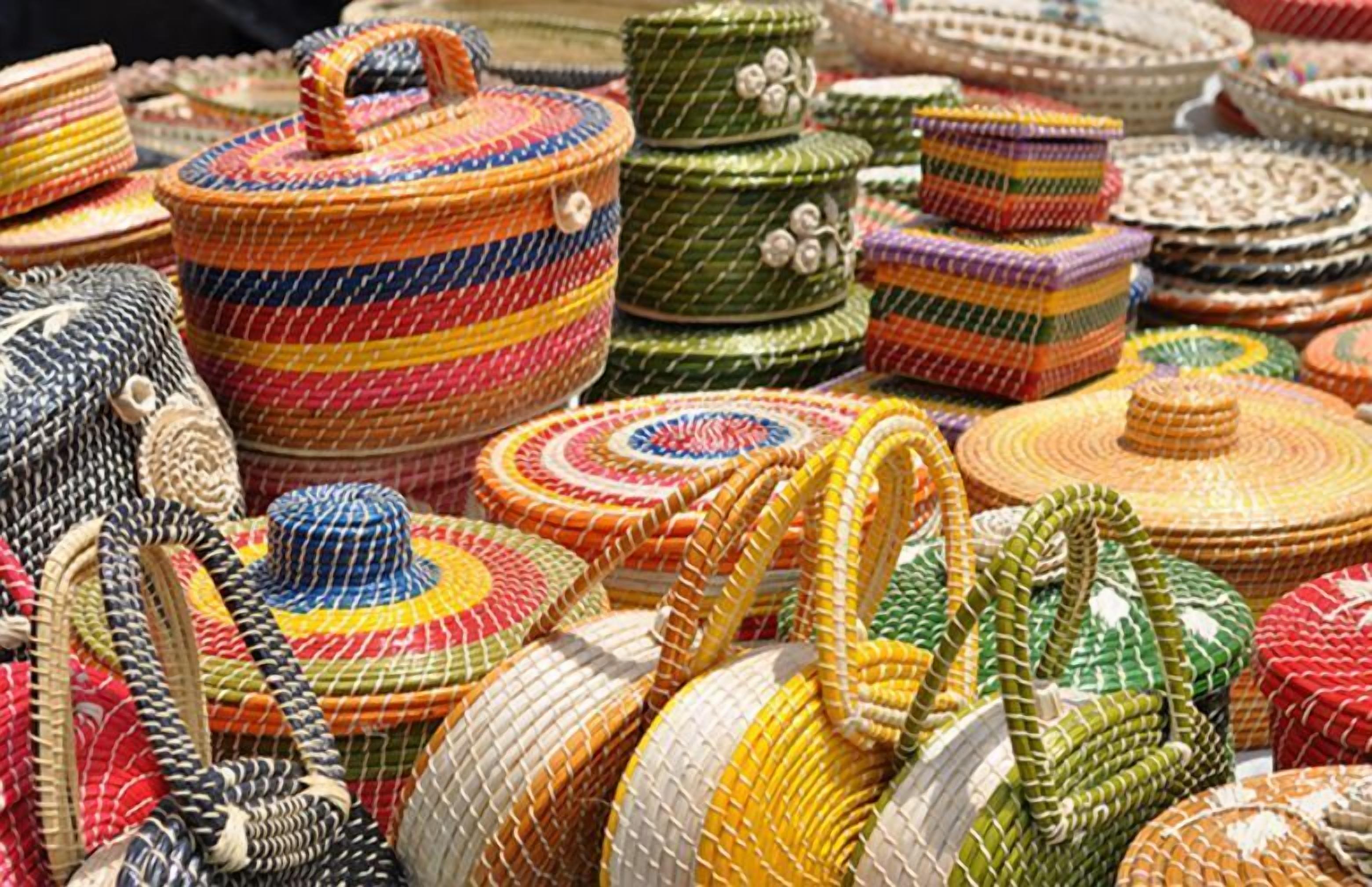 A variety of colorful woven baskets and containers.