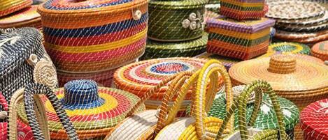 A variety of colorful woven baskets and containers.
