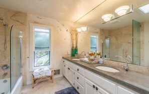 Bathtub, hair dryer, towels, soap