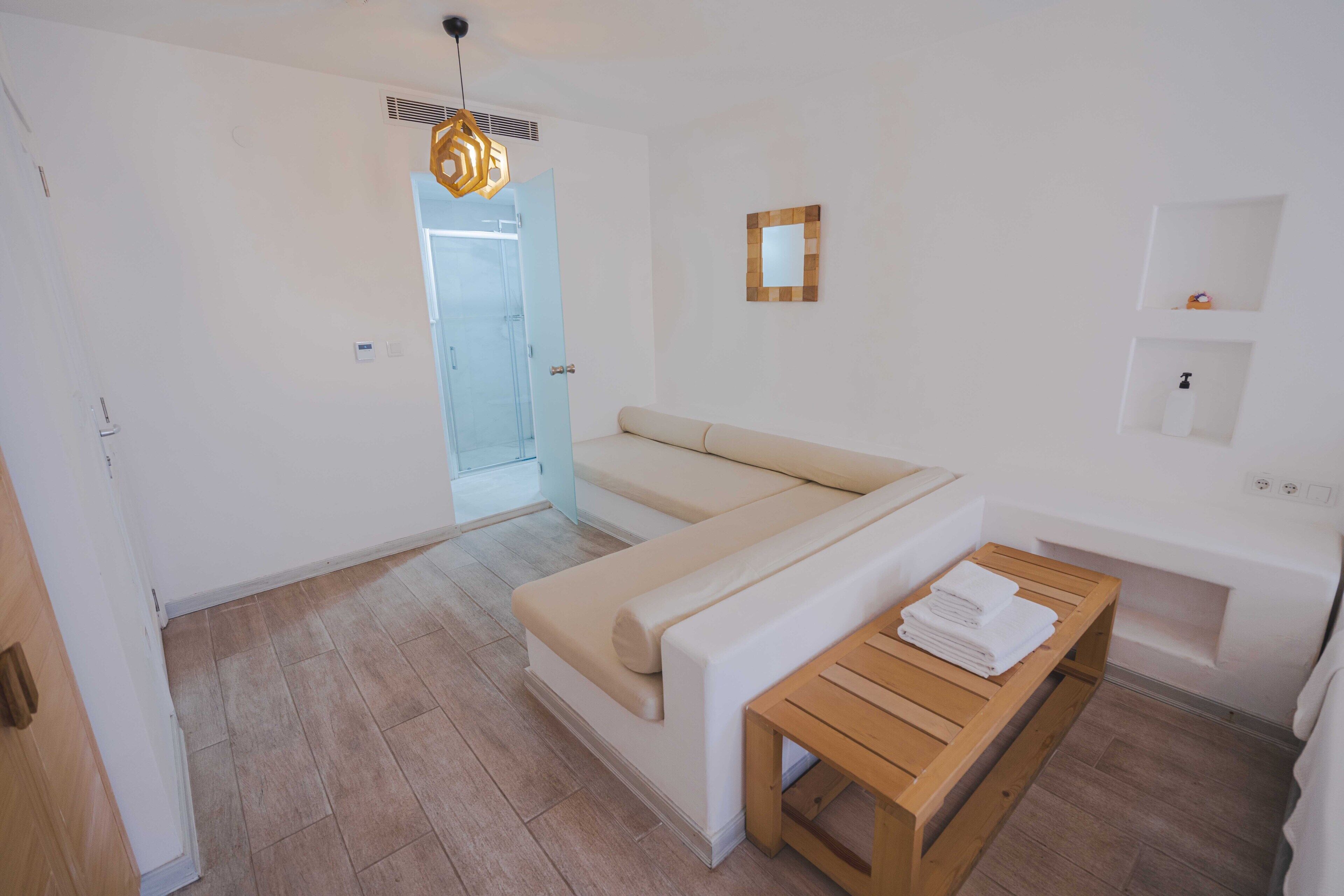 deluxe double room | living area | lcd tv