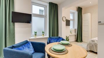 Premium Apartment | Living area | Flat-screen TV