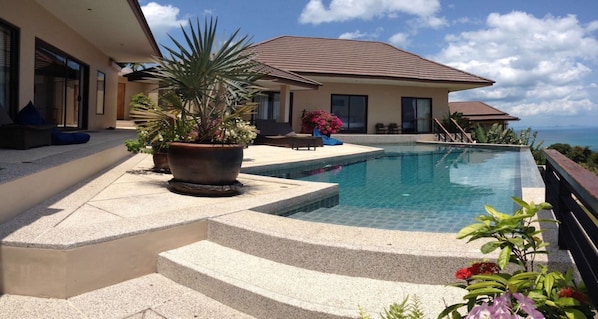 A modern house with a swimming pool, outdoor seating, and a view of the ocean. - 3 Bedroom Seaview Villa Angthong Hills SDV227E-By Samui Dream Villas (Koh Samui)